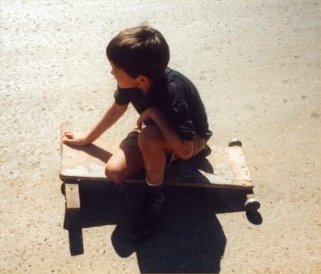 AE_1_21.jpg - Kid on a thing with wheels
